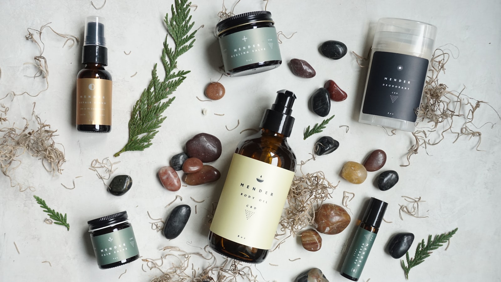 A dropper bottle of skincare serum resting on a soft neutral background